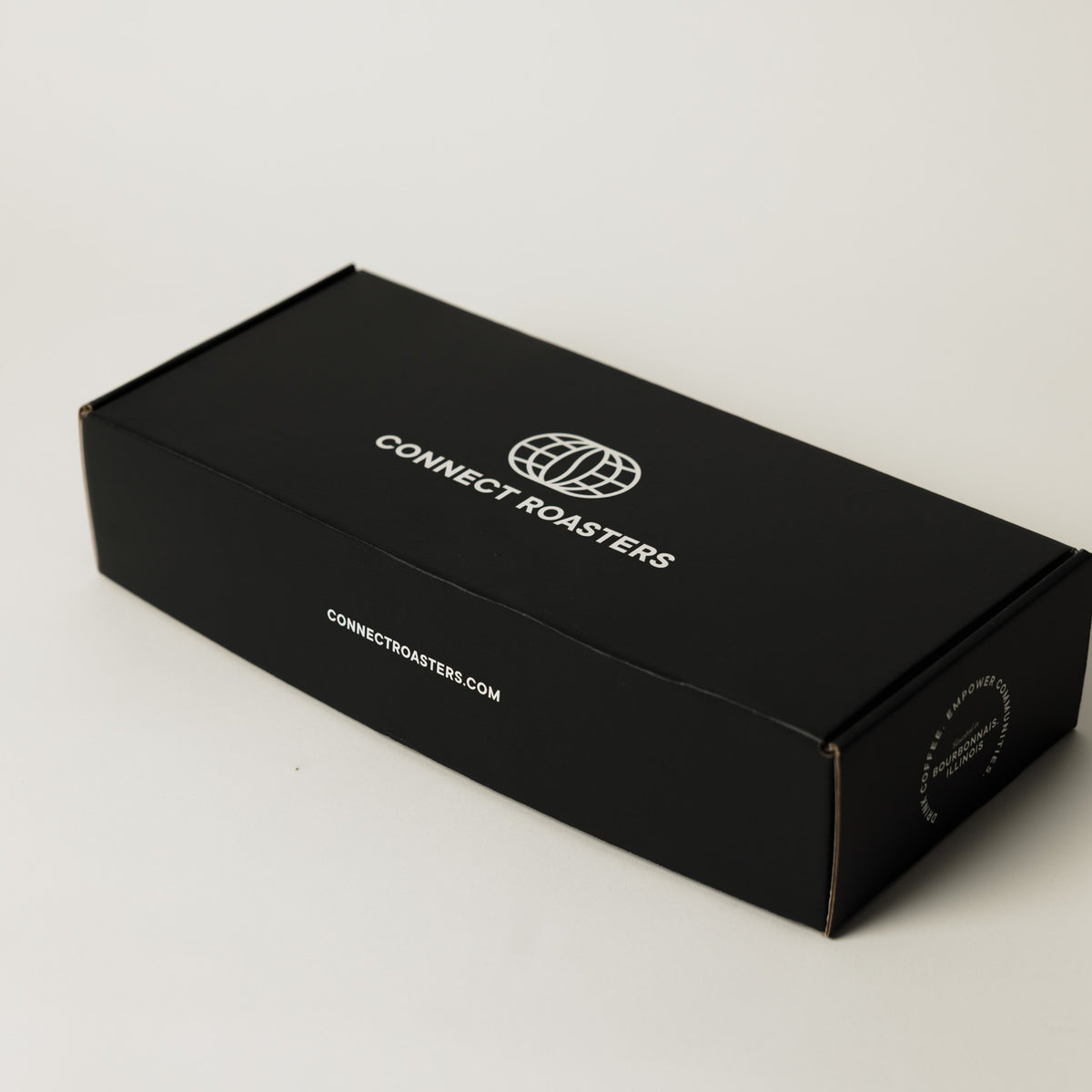 The Double gift box closed, showing the printed Connect Roasters gift box
