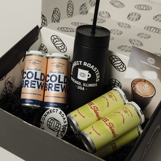 The Cold Case gift box with cold brew cans, Coffee Shandy cans and a Fellow Carter Cold tumbler