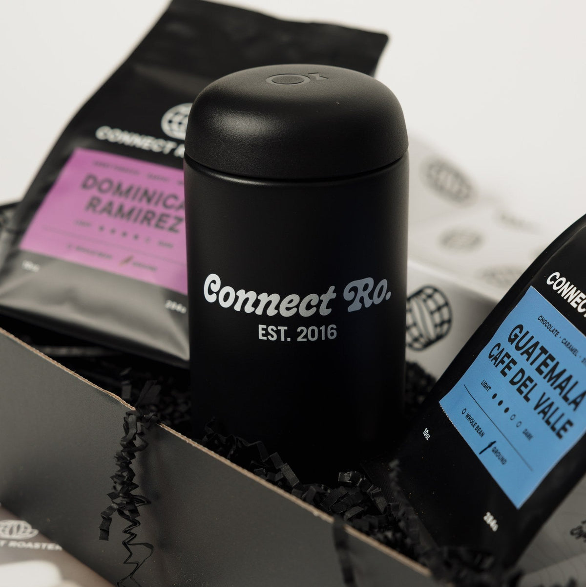 Close view of the Connect Roasters travel mug in the Commuter gift box